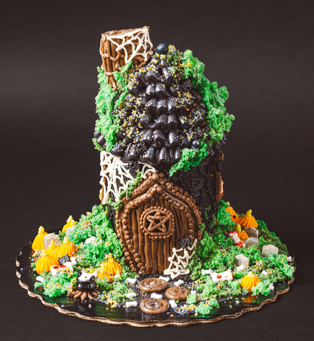 Gingerbread house with decorative elements on a dark background