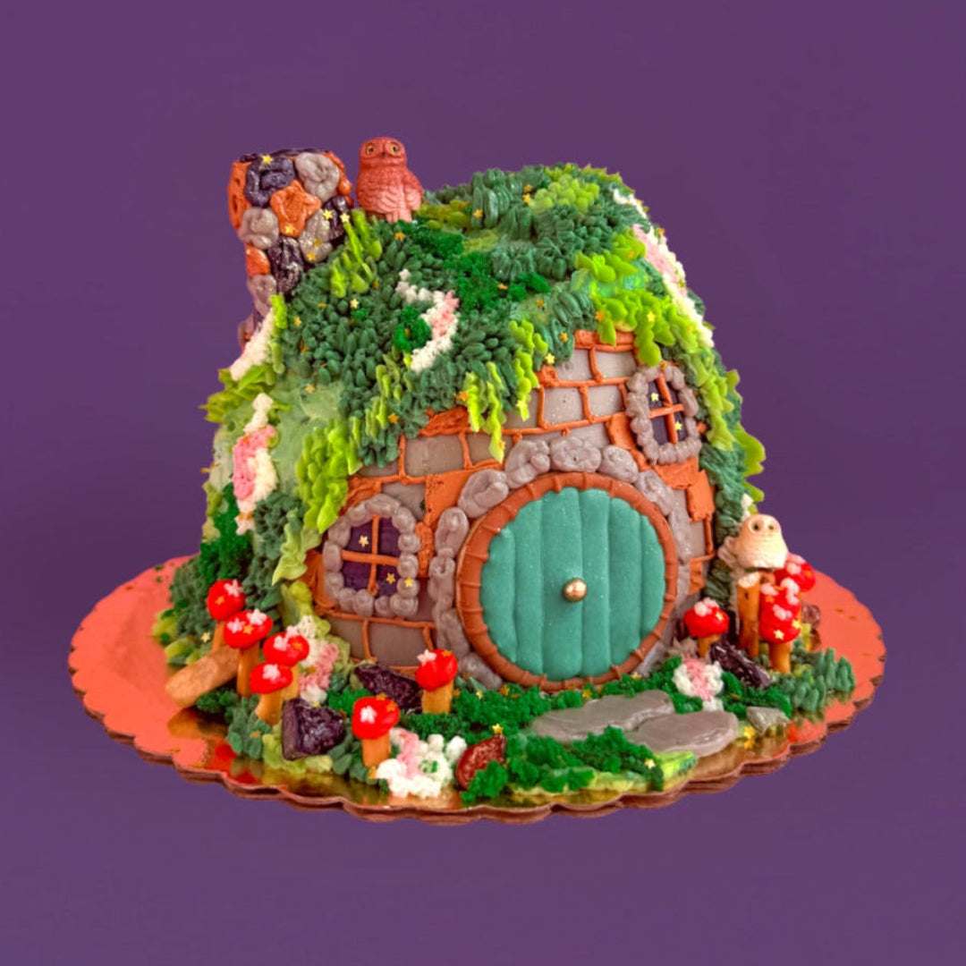 Fairy house with green door and red roof on a purple background