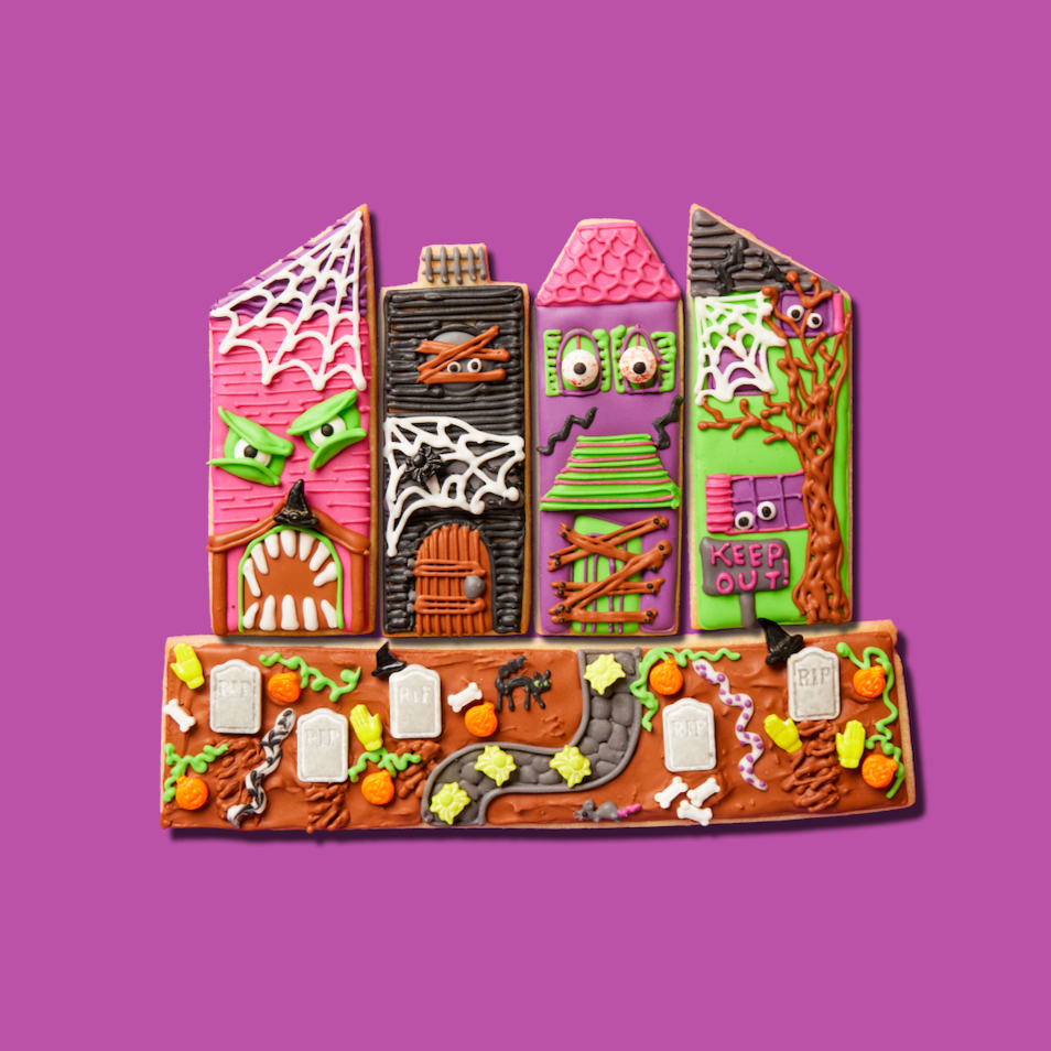 Decorative gingerbread house on a purple background
